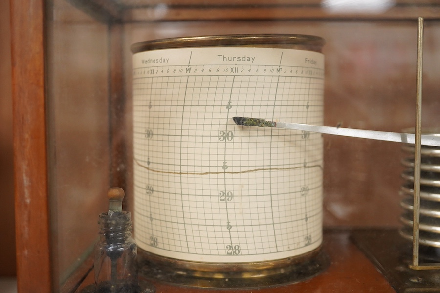 An early 20th century teak cased barograph by Ross, London No.A.529. with drawer underneath containing the original leaflet, spare papers, etc. Condition - fair to good.